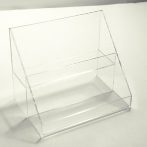 Custom acrylic plastic fabrication store displays jewelry trays brochure holders showcases racks shelves plexiglas lucite exhibits covers