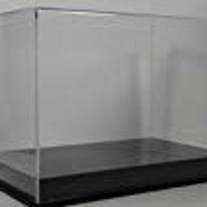 May include: Clear acrylic display case with a black base. The case is rectangular and has a hinged lid.