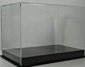 May include: Clear acrylic display case with a black base. The case is rectangular and has a hinged lid.