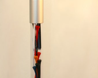 May include: A clear glass walking stick with a silver handle and a clear tube filled with colorful golf tees.
