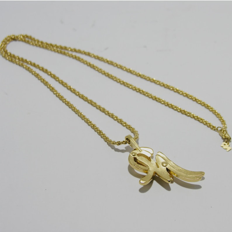 Simple vintage Nina Ricci gold-tone long necklace