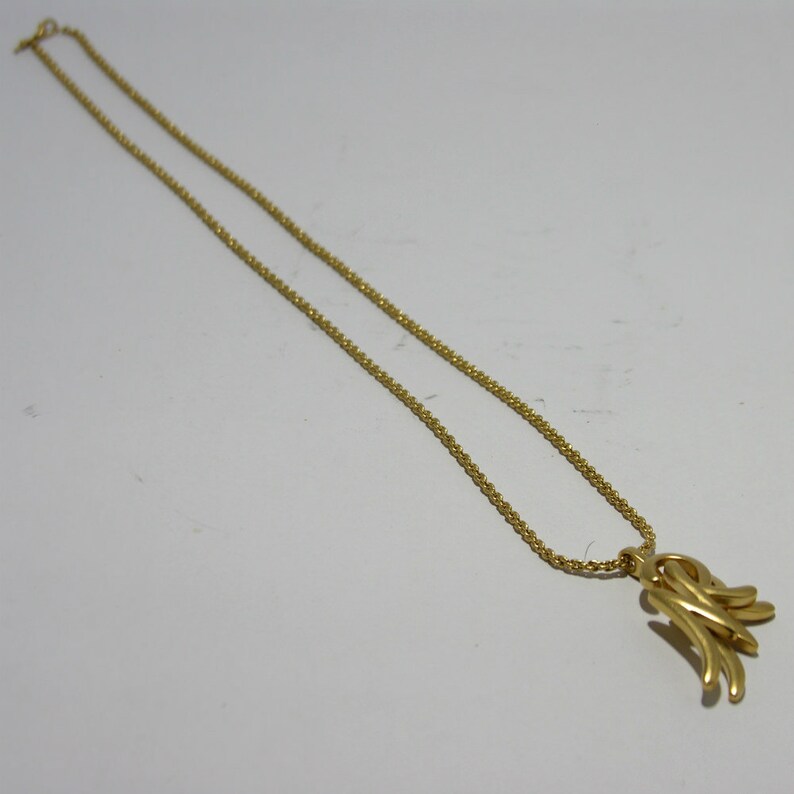 Simple vintage Nina Ricci gold-tone long necklace