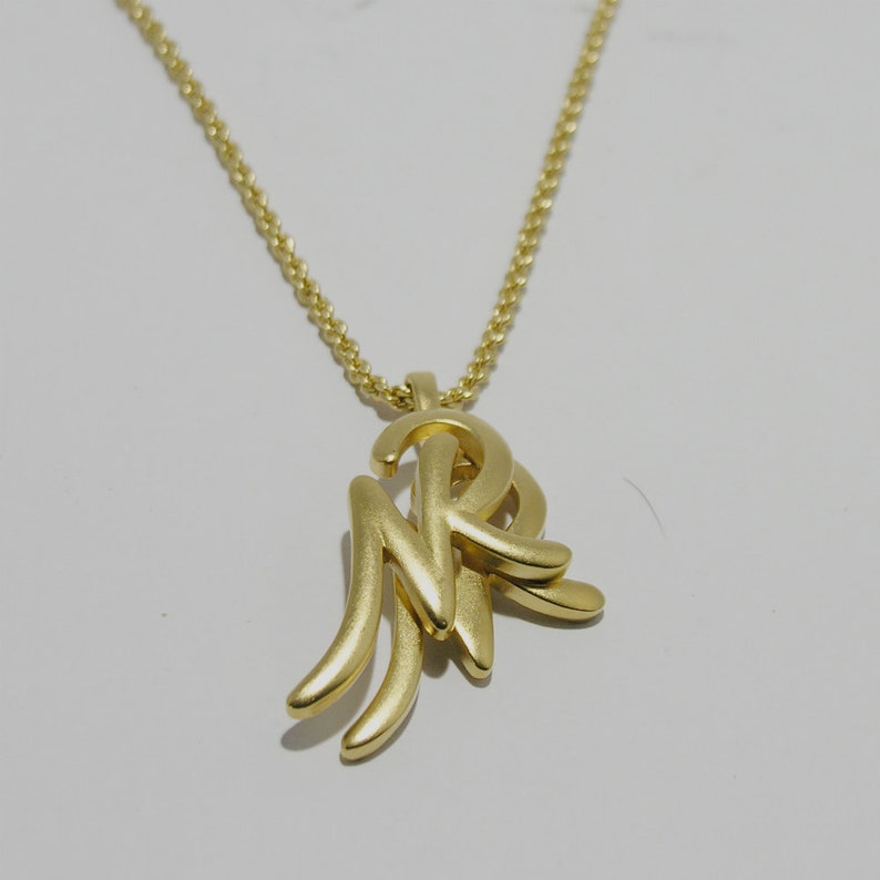 Simple vintage Nina Ricci gold-tone long necklace