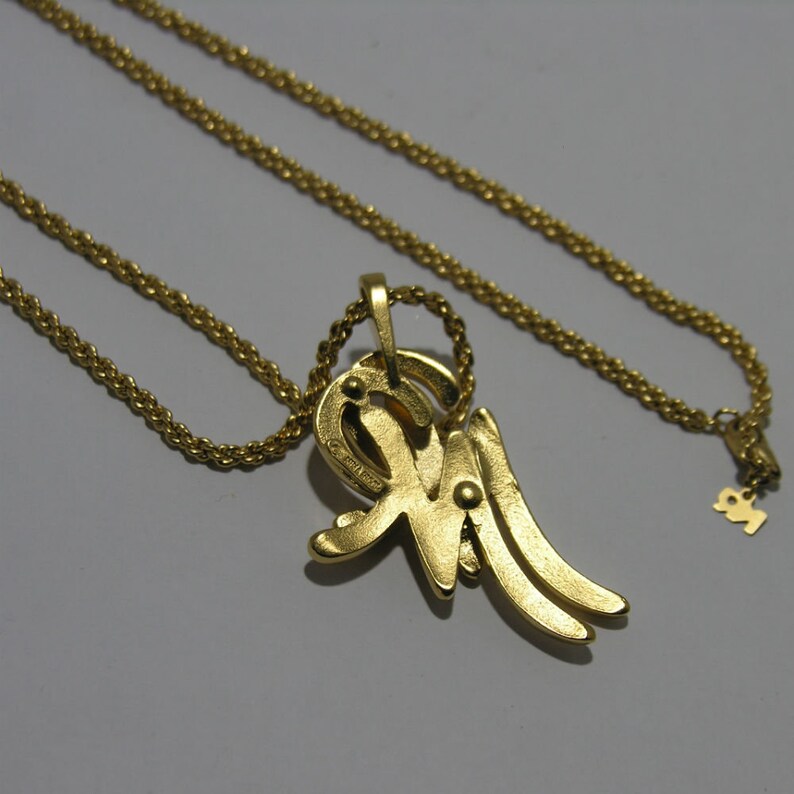 Simple vintage Nina Ricci gold-tone long necklace