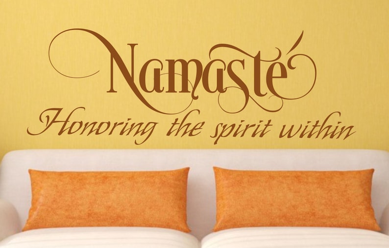 May include: A brown wall decal with the text "Namaste" in a decorative font, and the text "Honoring the spirit within" in a smaller font below.
