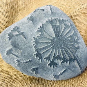 Dandelion blowing in the wind - Hand carved into natural stone in a relief effect, a lovely Cornish gift