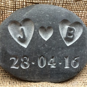 Love PEBBLE with initials carved into the hearts! along with a date, all hand carved into the stone &  personalised