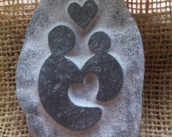 A hand carved baby love pebble! A perfect gift for new parents, grandparents or Godparents! 2 different designs. Plus a hessian gift bag