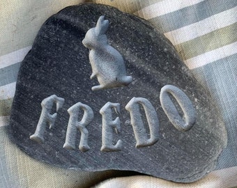 Hand carved memory stone with a silhouette of a rabbit above the name of your loved furry friend