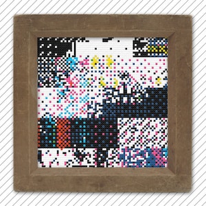 May include: A framed artwork featuring a colourful pixelated design with a variety of colours, including black, white, red, blue, green, and yellow.