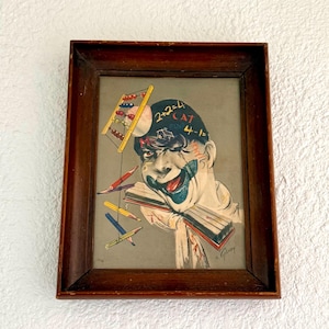 May include: A framed vintage illustration featuring a clown-like figure with a painted face and open book. The figure's head has math equations and an abacus. Colored pencils and an abacus float around the figure. The frame is dark brown.