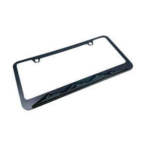 May include: Black metal license plate frame with a mountain range design.