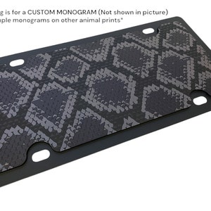 May include: Black and grey snake skin patterned licence plate cover. This listing is for a custom monogram (not shown in picture). See example monograms on other animal prints.