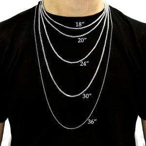 May include: A silver chain necklace with five different lengths: 18 inches, 20 inches, 24 inches, 30 inches, and 36 inches.