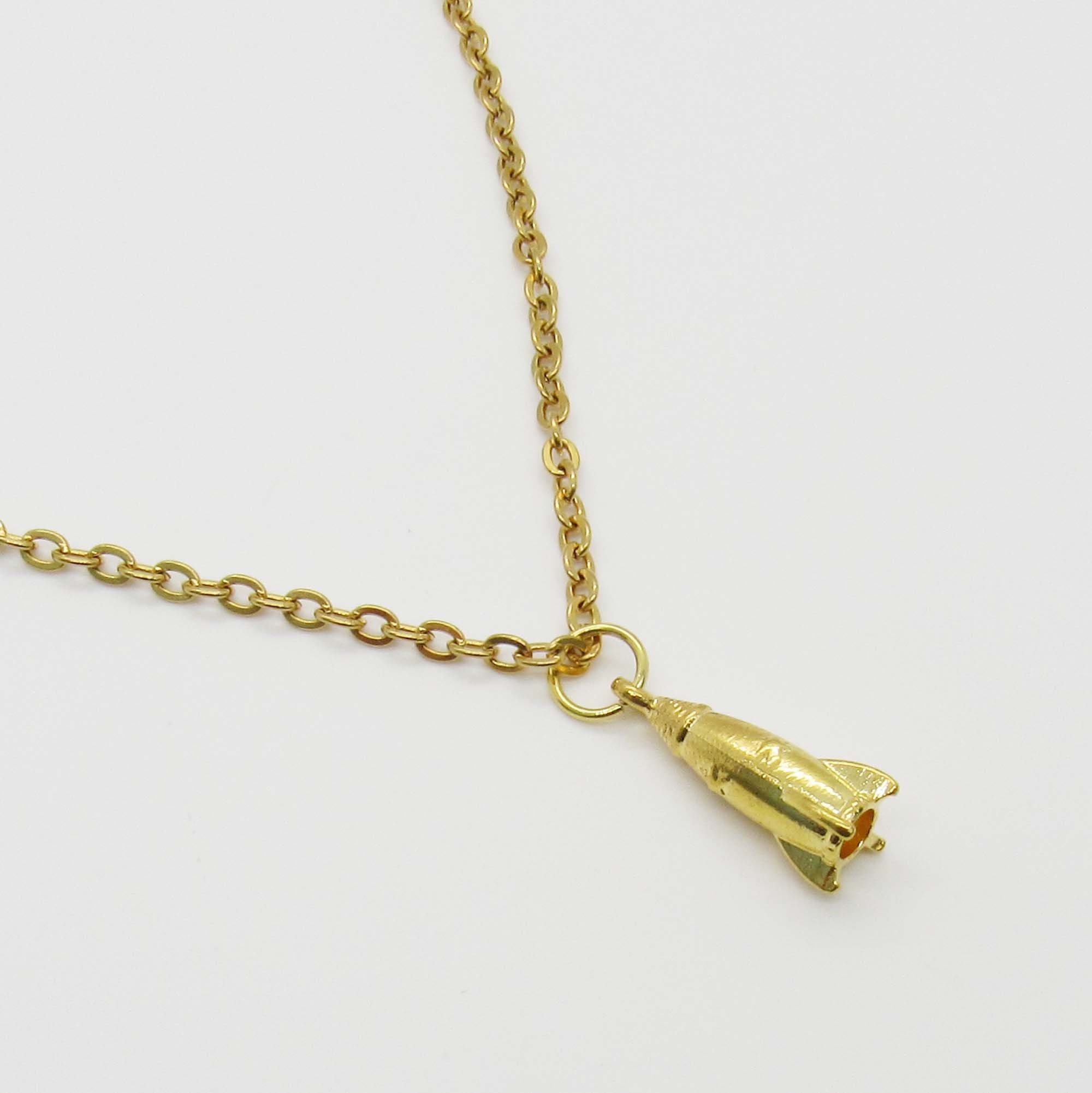 Gold spaceship best sale pendant