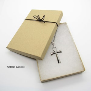 May include: A silver Ankh pendant necklace in a brown gift box with a black ribbon.  Gift Box available.