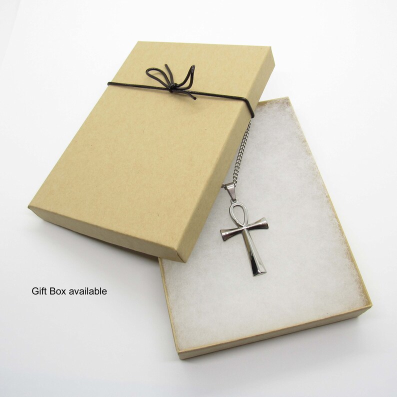 May include: A silver Ankh pendant necklace in a brown gift box with a black ribbon.  Gift Box available.