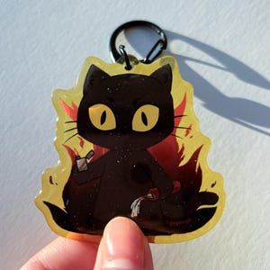 Arson Cat Glitter Acrylic Keychain