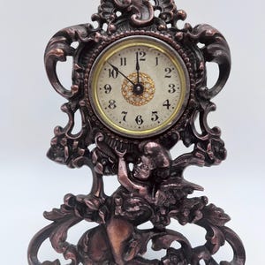 Rare Working Antique Warner Cherub Mantel Clock Heavy Iron with Copper Wash Patent Feb. 1904!