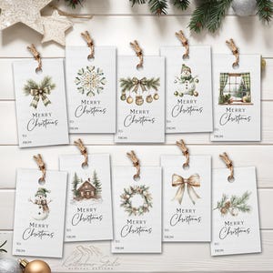 May include: A collection of white Christmas gift tags with various watercolor designs, including bows, snowflakes, snowmen, and wreaths. Each tag has the words "Merry Christmas" and space for "To" and "From" with a twine string.