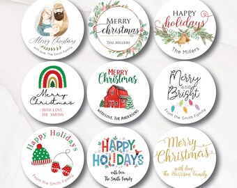 May include: Nine round Christmas gift tags with various designs. The tags feature illustrations of a nativity scene, a farmhouse, a rainbow, a Christmas tree, a winter hat and mittens, a Christmas village, and a string of lights. The tags also include the text "Merry Christmas", "Happy Holidays", and "Merry and Bright".