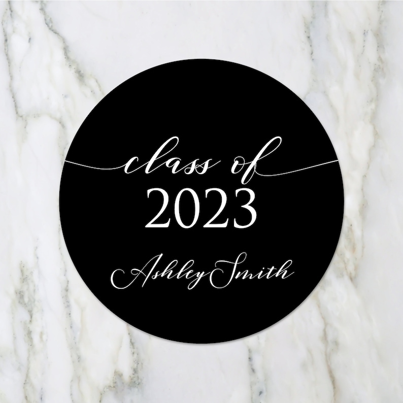 May include: Black and white circle sticker with the text "class of 2023" and "Ashley Smith" in a cursive font.