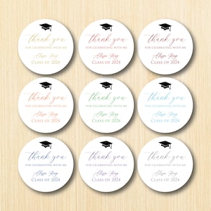 May include: Nine round white stickers with a black graduation cap and the text "Thank you for celebrating with me Alissa King Class of 2024" in various colors.