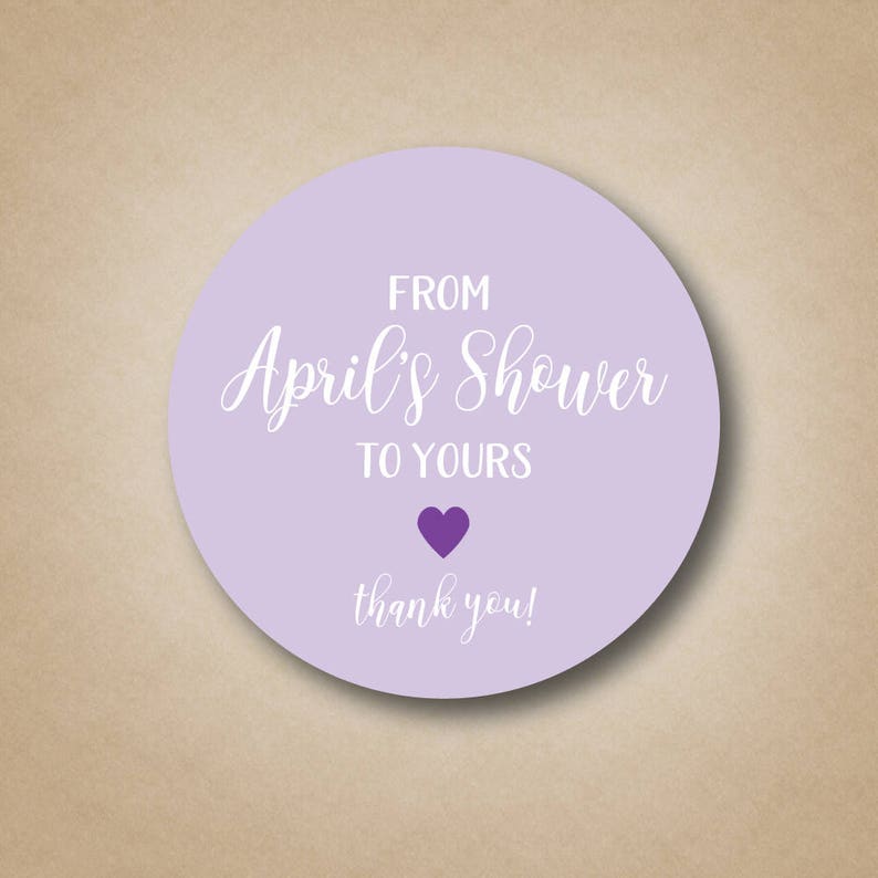 May include: Purple and white round sticker with the text "From April's Shower to Yours" and a small purple heart. The text "thank you!" is below the heart.