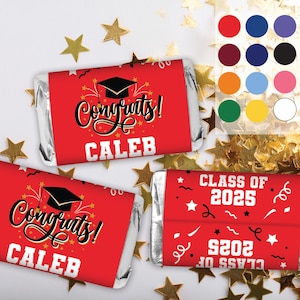 May include: Red and white graduation party favor chocolate bar wrappers with gold accents. The wrappers feature the text "Congrats!" and "Caleb" and a graduation cap. Another wrapper features the text "Class of 2025".