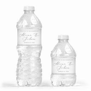 May include: Two clear plastic water bottles with white labels. The labels have black text that reads "Welcome to the wedding of Alrine & Jackson March 15, 2028".