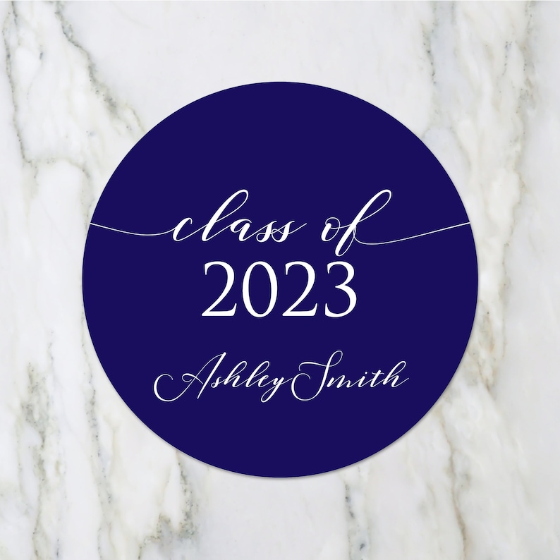 May include: A navy blue circle with white text that reads "class of 2023" and "Ashley Smith".