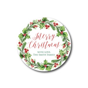 May include: Round Christmas sticker with a green holly wreath with red berries and the text "Merry Christmas" in red cursive lettering. The text "With love, The Smith Family" is written in black below the wreath.