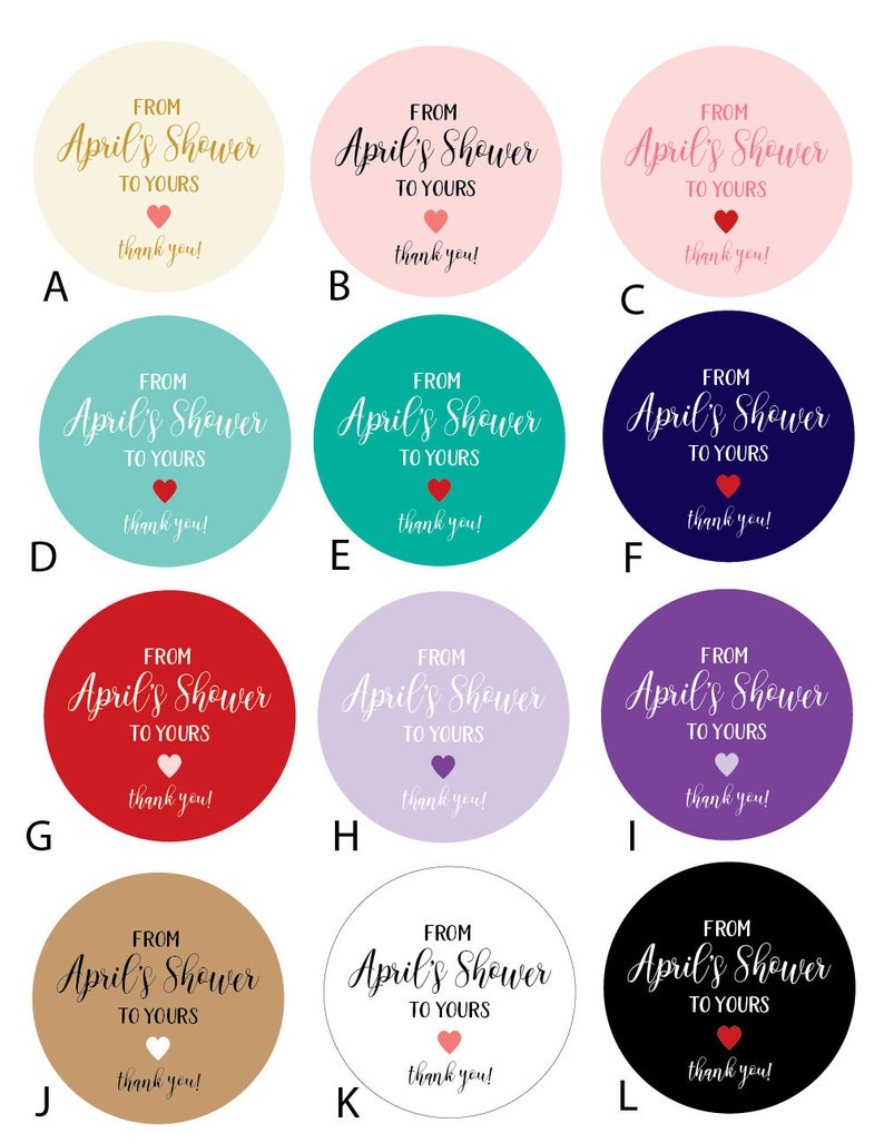May include: Twelve round favor tags with the text "From April's Shower to Yours" in gold script with a small red heart. The tags are in various colors: beige, pink, teal, red, purple, light purple, brown, white, and black.