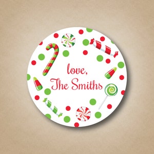May include: Round white sticker with red and green candy canes, lollipops, and wrapped candies on a white background with red polka dots. The text "love, The Smiths" is in red.