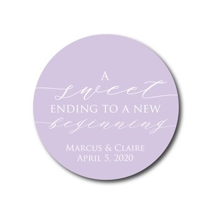May include: A lavender circle sticker with the text "A sweet ending to a new beginning" in white script font. Below the text is "Marcus & Claire April 5, 2020" in white sans-serif font.