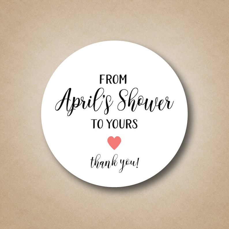 May include: White round sticker with black text that says "From April's Shower to Yours" with a small pink heart and the words "thank you!" below.