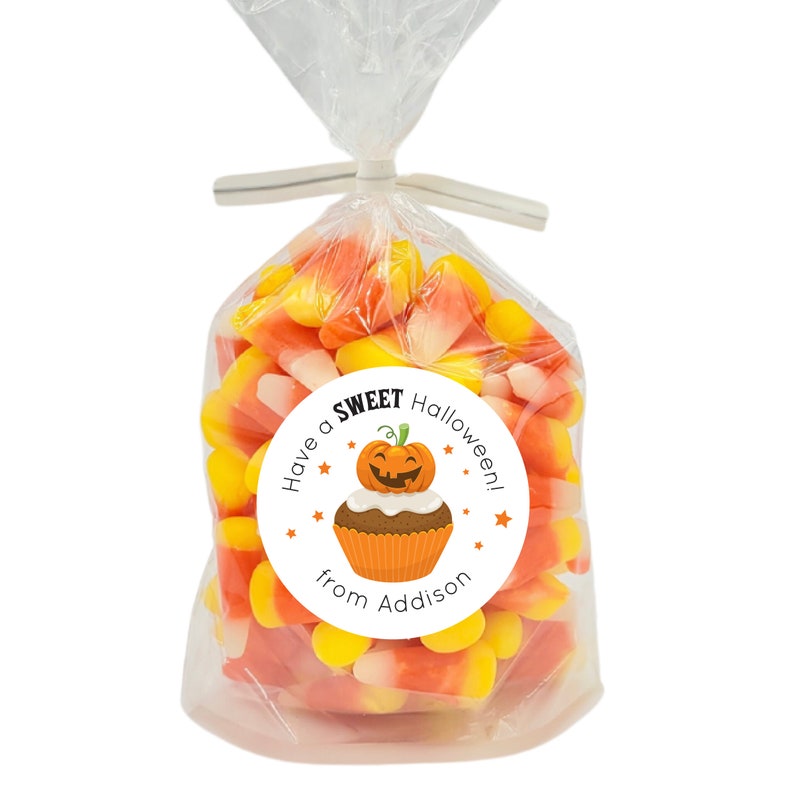 May include: A white circle sticker with a pumpkin cupcake illustration and the text "Have a SWEET Halloween! from Addison".