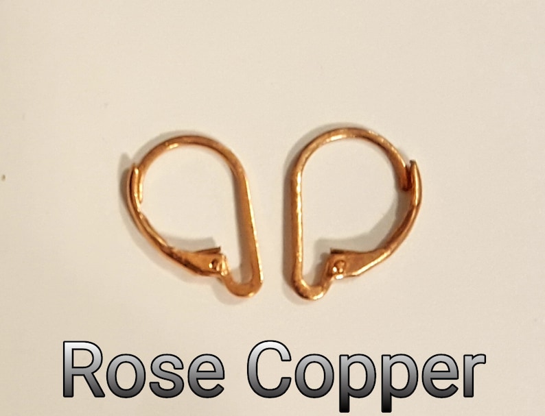 May include: Two rose copper leverback earring findings. The findings are a warm, reddish-orange color. The text "Rose Copper" is displayed in a black font at the bottom of the image.
