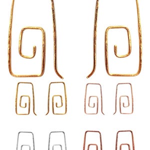May include: A collection of six pairs of earrings in various metallic finishes. The earrings feature a rectangular frame with an interior spiral design. Colors include gold, silver, and copper. The earrings are displayed on a white background.