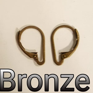 May include: Two bronze-colored earring lever backs. The lever backs are in the open position, showing the curved design. The word "Bronze" is printed in a black and white font below the earring lever backs.