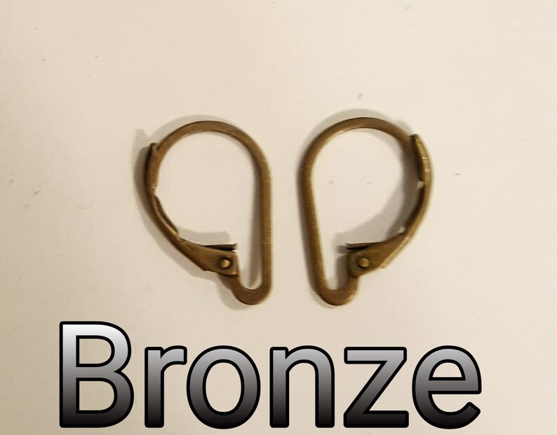 May include: Two bronze-colored earring lever backs. The lever backs are in the open position, showing the curved design. The word "Bronze" is printed in a black and white font below the earring lever backs.