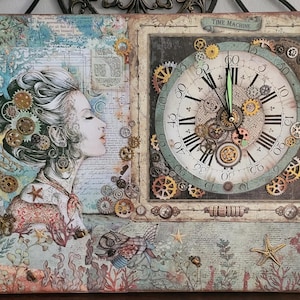 May include: Mixed media canvas art showing a woman's profile with gears in her hair, and a clock face with gears. The clock face has Roman numerals and the words "TIME MACHINE" above it. The colour palette includes blues, browns, and golds.