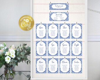 May include: Blue and white patterned table number cards with a lace design. The cards are numbered one through twelve and are hung on a white board with clips. The board has a pink ribbon at the top and the text "Find your seat" and "Head Table" on two smaller cards.