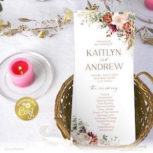 May include: Wedding ceremony program with a floral design featuring a bouquet of pink, white, and burgundy flowers with greenery. The program lists the names Kaitlyn and Andrew, the date Saturday, June 15, 2024, and the location Gold Head Garden, Lyon, France. The program includes the order of the ceremony: Prelude, Processional, Opening Prayer, First Reading, Second Reading, Unity Candle, Prayer of the Faithful, Marriage Vows, Exchange of Rings, Nuptial Blessing, Prayer, Final Blessing, and Recessional.