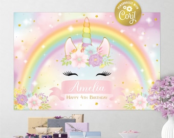 May include: A pink and blue unicorn backdrop with a rainbow, gold stars, and flowers. The backdrop has the text "Amelia Happy 4th Birthday" on it.