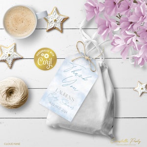 May include: Blue and white watercolor thank you tag with the text "Thank You" and "Lauren's Baby Shower August 17, 2024".