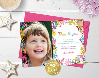May include: A colorful thank you card with a photo of a young girl smiling. The card has a paint splattered design with the text "Thank you" and "Love, Amelia".