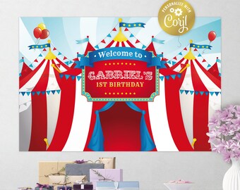 May include: A red and white striped circus tent backdrop with blue accents. The backdrop features a sign that says "Welcome to Gabriel's 1st Birthday".