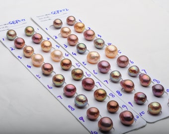 May include: Two rows of iridescent pearls in various shades of pink, peach, and white, displayed on a white card with numbers 1 through 10. The card is labeled "SEP001" and "SEP002".