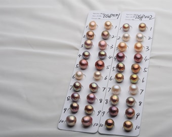 May include: Two white cards with numbers 1 through 10 printed on them. Each card has 10 pearls of different colors and sizes arranged in rows. The pearls are white, pink, brown, and iridescent.